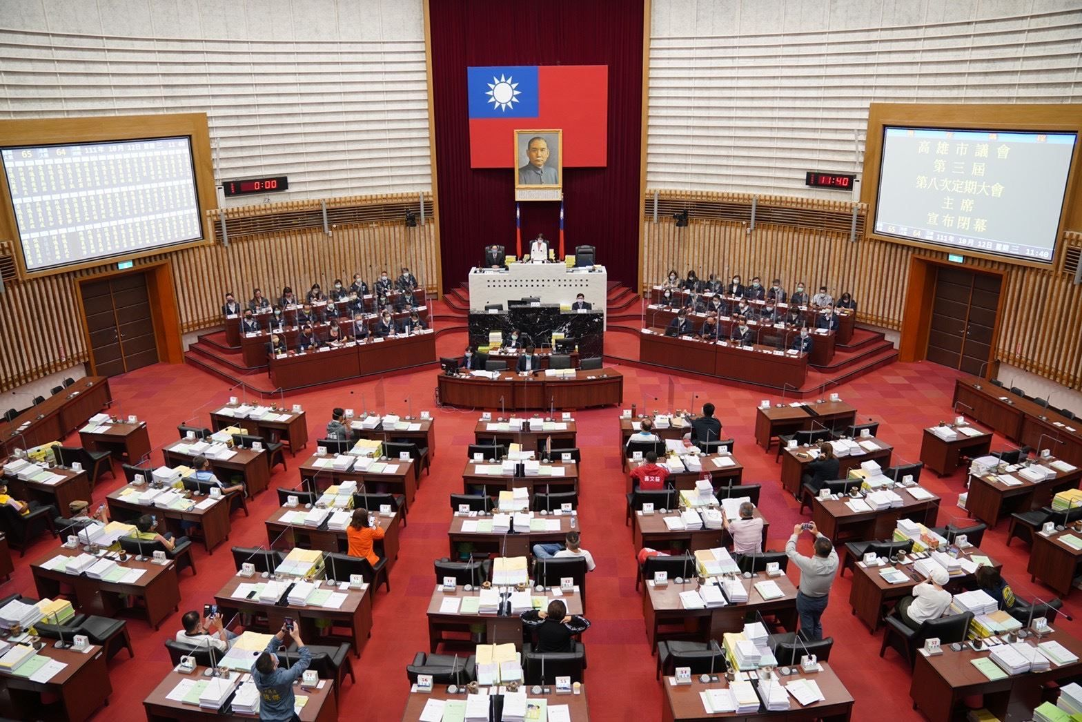 Wide view of a formal session in the Kaohsiung City Council chamber.